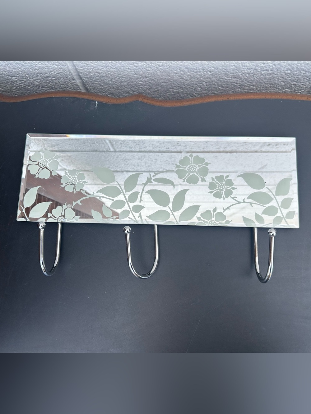 glass mirror coat rack featuring three chrome metal hooks and a delicate frosted